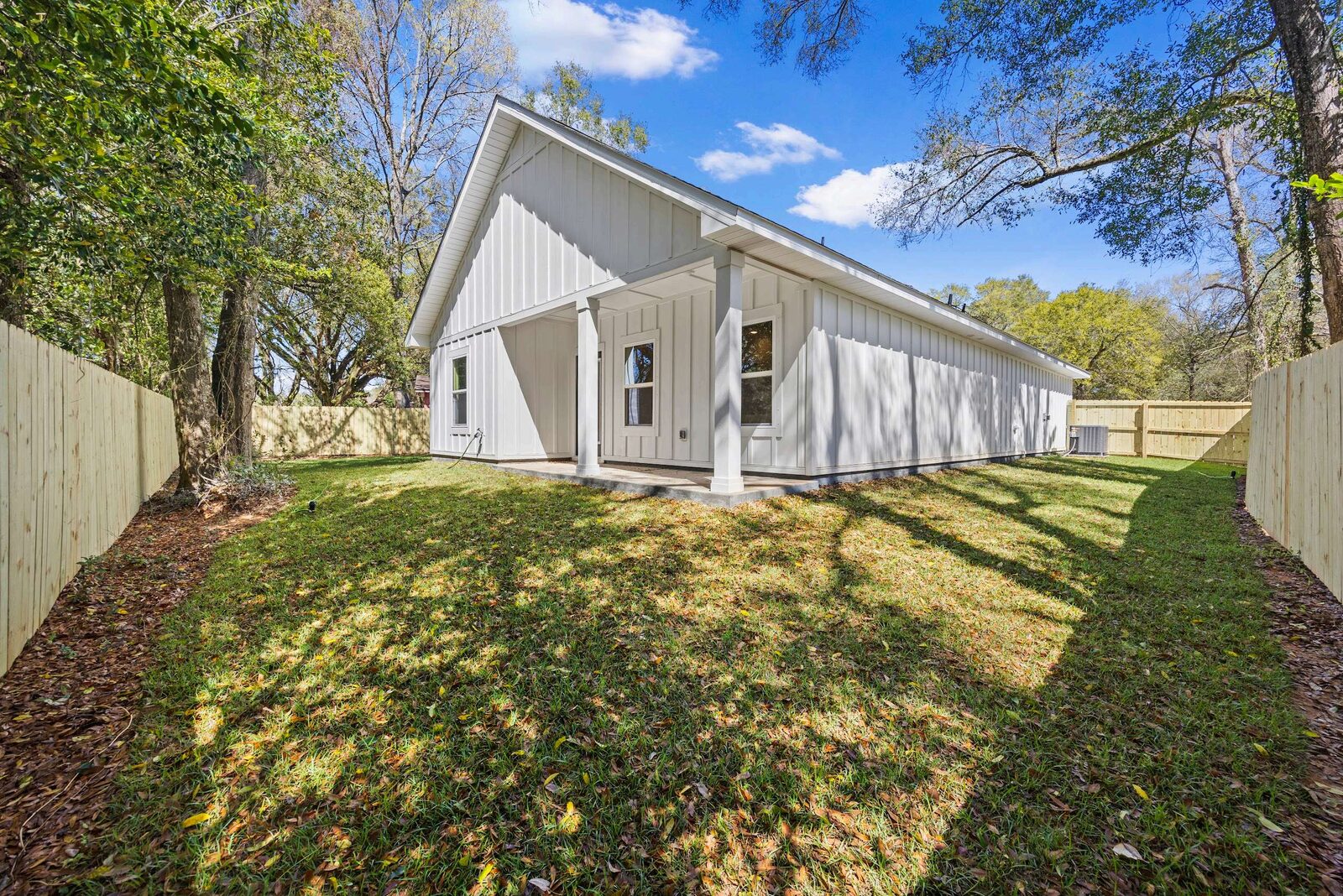 Backyard and privacy fence of an AJAC Group new construction home